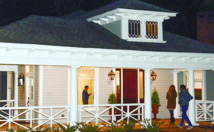 Curious visitors arrive on a cool November night last year to tour the recently refurbished home on Eatonton’s Wayne Street.