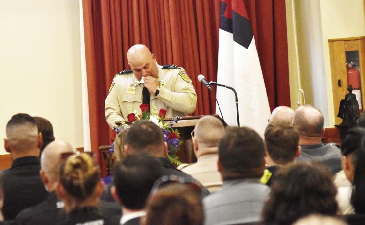 Lt. Patrick Paquette tears up at K9 Deputy Oby's funeral last week at McCommons Funeral Home. T. MICHAEL STONE/Staff