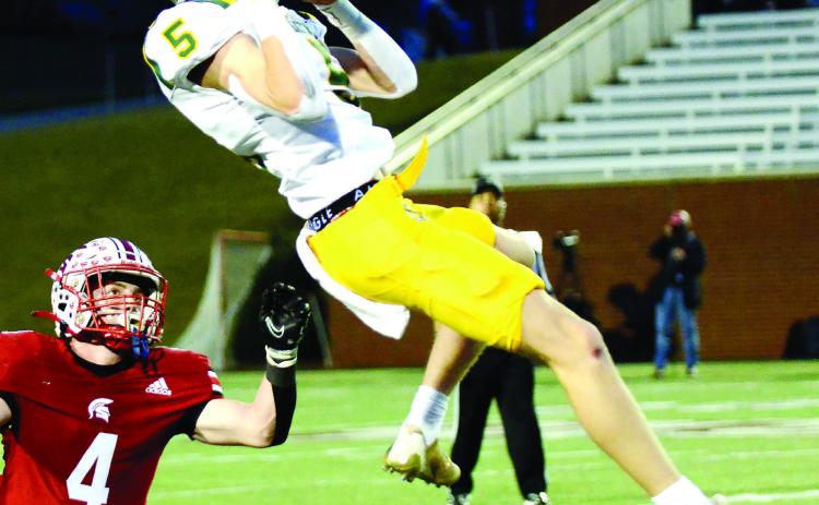 Blake Callaway leaps high in the air to complete just one of at least three outstanding catches he made on the night in the state title game at Mercer. IAN TOCHER/Staff