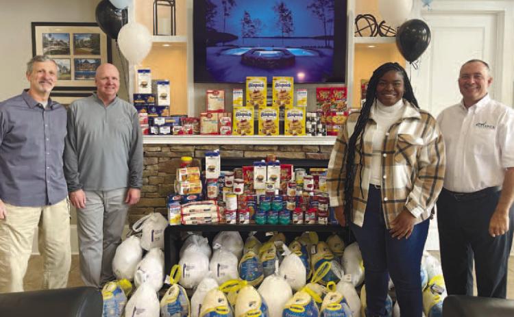 The Alliance Home &amp; Land Group donated 48 turkeys and non-perishable food to Putnam Christian Outreach and the Greene County Food Pantry. CONTRIBUTED
