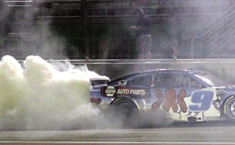 Chase Elliott celebrates Saturday night’s win at EchoPark Speedway with a burnout. BRAD HARRISON/Staff