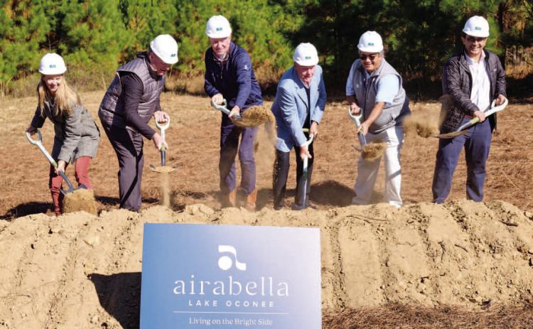 From left, Airabella Lake Oconee partners Abby Port, Kevin Bryant, Dr. Robert Cowles lll, Heinz Nathe, Vilas Patel and Ishaan Patel break ground on a 137-acre mixed-use development off Linger Longer Road. Photo courtesy of BRANDON AMATO