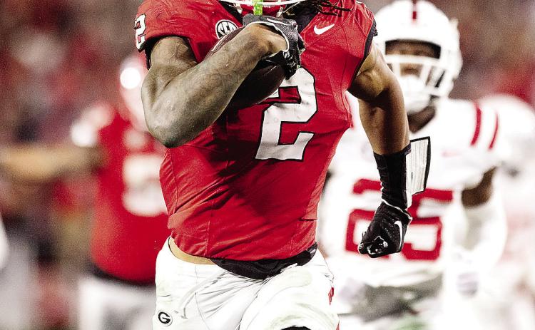 Senior running back Kendall Milton (2) had the breakout game of his career against Ole Miss in Athens, rushing for 127 yards and two touchdowns on nine carries. ZAK ROBINSON/Contributed