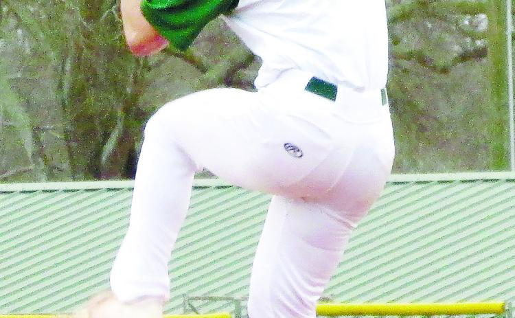 Wilson Moore (10) gets set from the bump as he prepares to deliver a pitch. TREY NORRIS/Staff