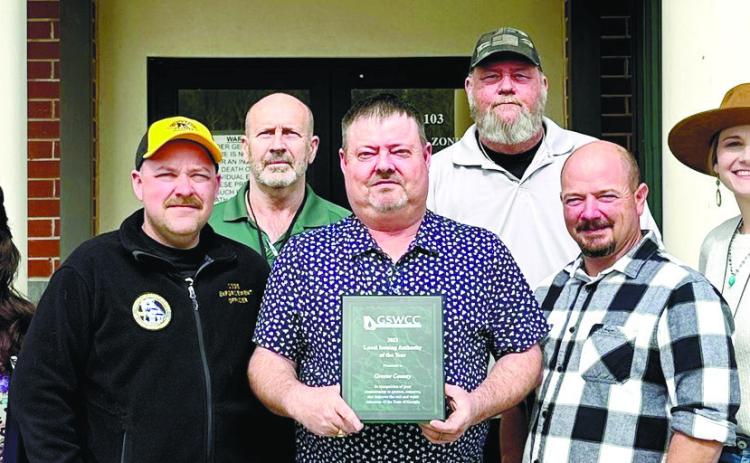 Chuck Wooley, center, and the staff of the Planning & Zoning department were awarded for by the Georgia Soil and Water Conservation Commission. CONTRIBUTED