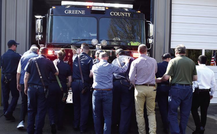 Greene County firefighters performed a traditional “push-in” ceremony last week for their new firetruck at Reynolds, mimicking the days when horse-drawn equipment had to be detached and pushed backward into the station in preparation for the next call. T. MICHAEL STONE/Staff