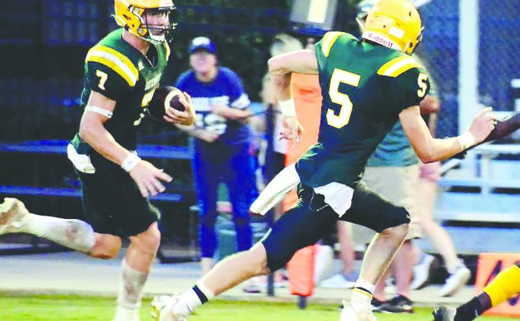 Fellow Gatewood seniors Evan Bennett (7) and Blake Callaway (5) each scored two touchdowns in the Gators’ 35-0 win over the Trinity Christian Crusaders Friday night in Dublin. FILE PHOTO
