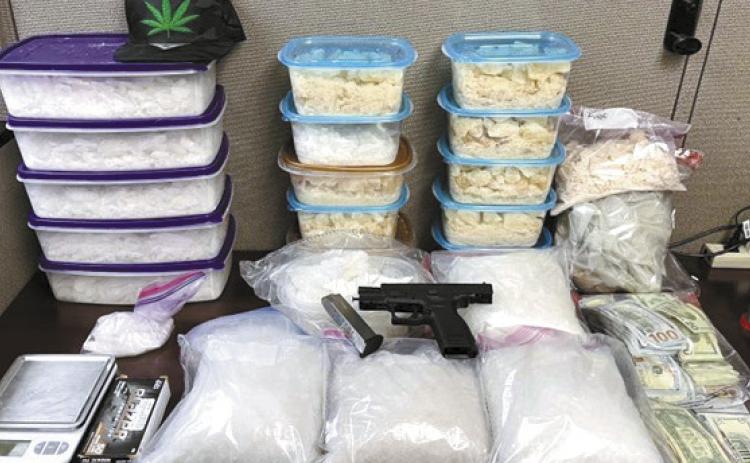 Law enforcement agencies seized 39 kilos of meth, handguns and $32,000 in cash. CONTRIBUTED