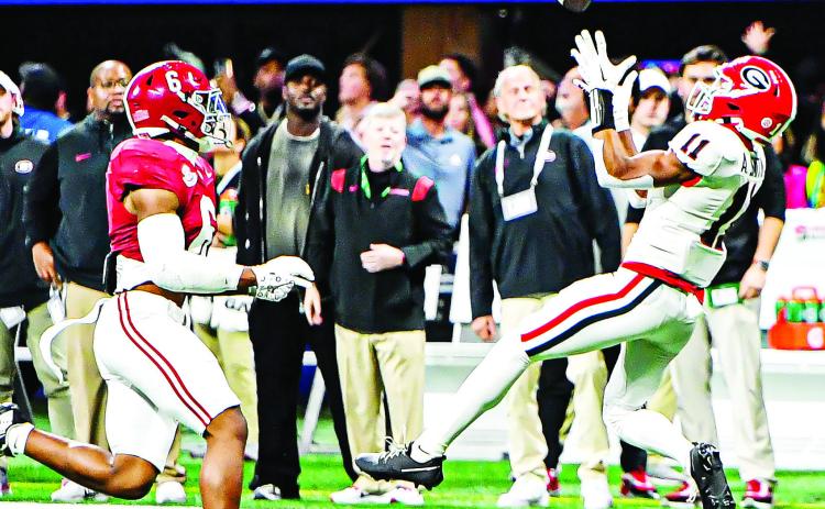 Georgia wide receiver Arian Smith (11) got into the action during the SEC Championship game against Alabama on a 51-yard reception. CHARLES JORDAN/Staff