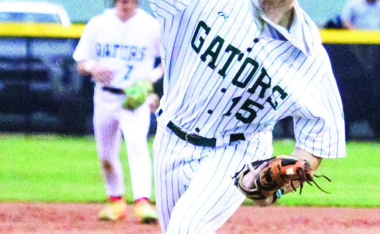 Gatewood senior Lawson Wooten (15) brings the heat last Tuesday in the Gators’ season opener at home against the Westfield Hornets. TREY NORRIS/Staff