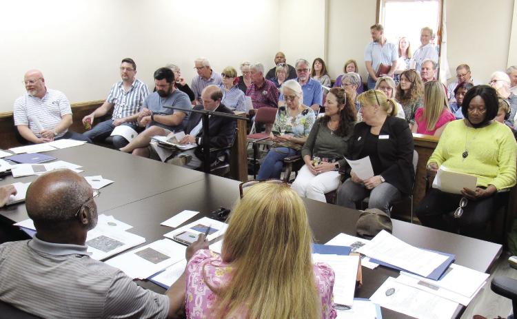 The meeting room used by the Greensboro Planning &amp; Zoning Board was literally standing room only as board members heard arguments regarding a proposed light-industrial development on 364 acres. MARK ENGEL/Staff