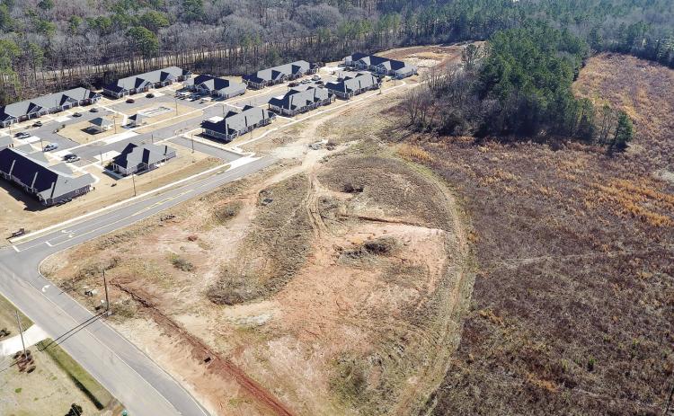 The proposed workforce housing development will be located on 52 acres of land (foreground) that is adjacent to the recently opened Villages at Baynes Creek senior living community on Oconee Avenue. MARK ENGEL/ Staff