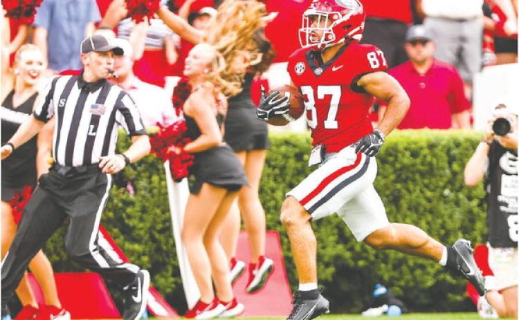 Mekhi Mews (87) breaks away from Ball State defenders during a 69-yard punt return, which sparked the Bulldogs to score 45 unanswered points. TONY WALSH/UGA Athletics