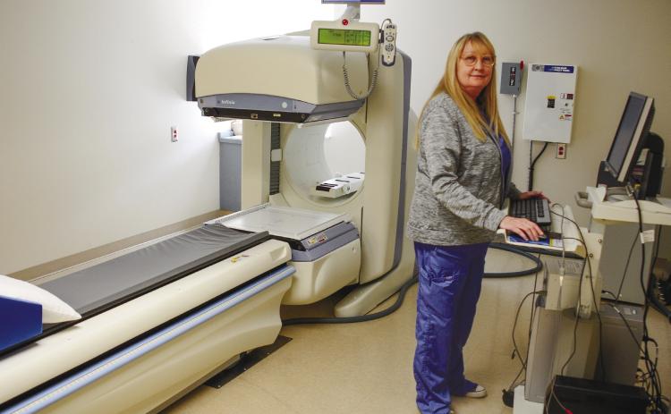 PGH Radiology Director Tina Cooper stands at the controls of a nuclear camera that can detect bone cancers, heart disease and gallbladder problems, among many other internal conditions.