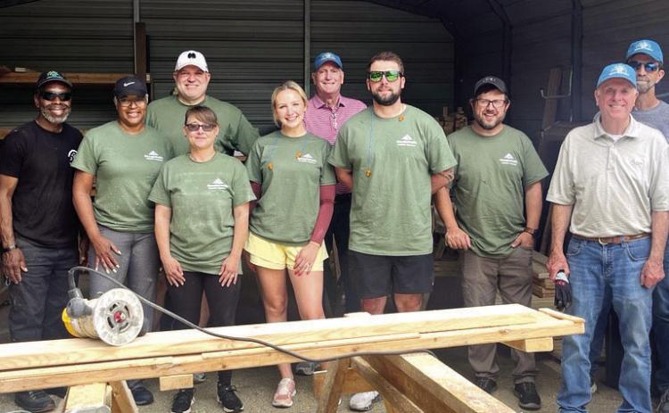 G-P employees help NHN build and deliver kids’ beds. CONTRIBUTED