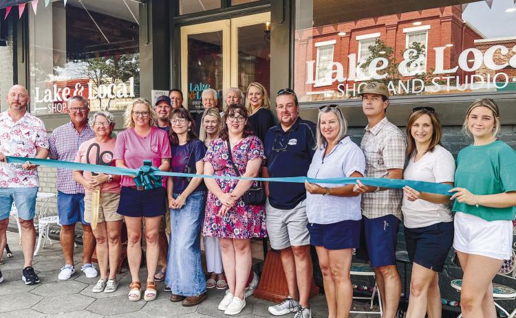 Lake & Local cut the ribbon to their new location alongside Chamber of Commerce members The Palms on Main and The Boat Shop. CONTRIBUTED