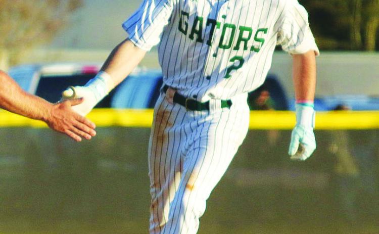 Gatewood senior Ben Brannen rounds the bases after hitting his first home run of the season on March 13 against Trinity Christian. TREY NORRIS/Staff