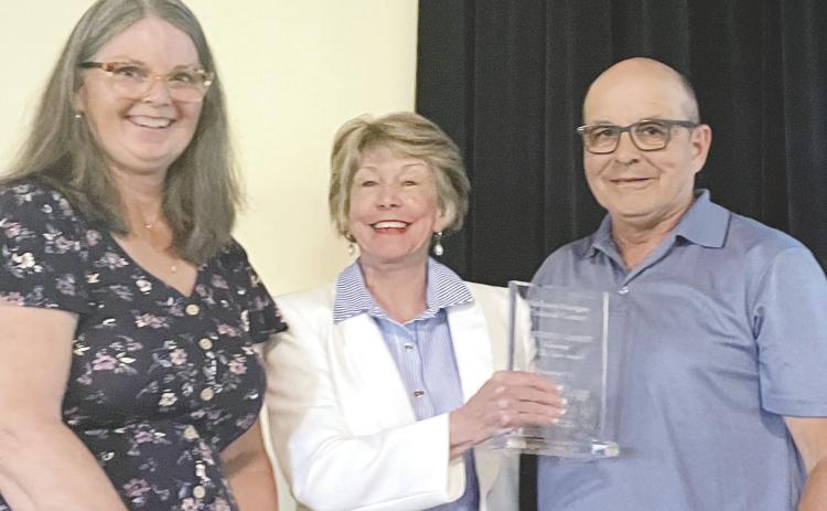 MMCC Volunteer Committee Chair Sally Hoge (left) presented the organization’s Volunteers of the Year award to Kathy and Ed Karpinski for their consistent dedication – rain or shine – to volunteering when needed at every MMCC event. CONTRIBUTED