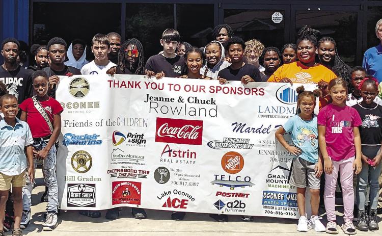 Children attending Pete Nance Boys &amp; Girls Club pose for a group photo thanking sponsors of the BBQ fest. MAUREEN STRATTON/Staff